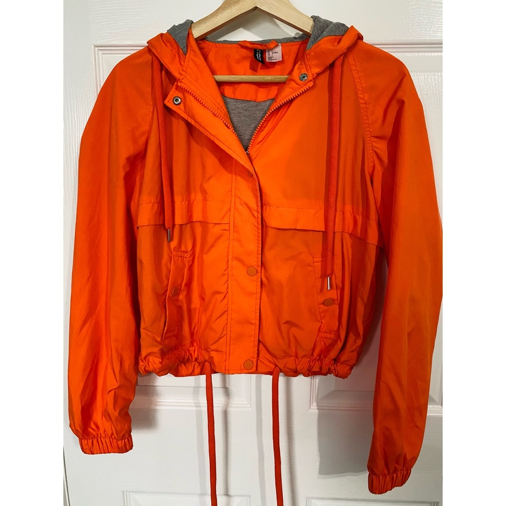 • orange wind breaker •